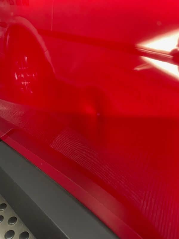 Toyota RAV4 door dent — before